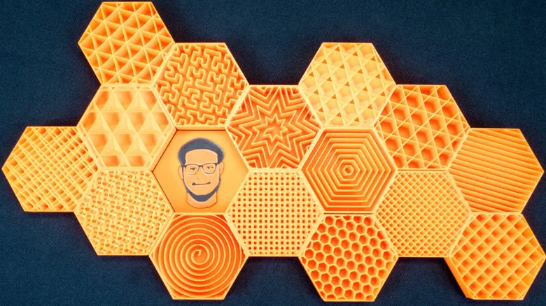 Orange 3D-printed hexagonal samples displaying different infill patterns.