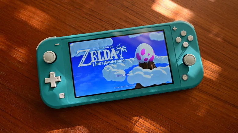 Zelda: Link's Awakening title screen on a blue Nintendo Switch Lite.