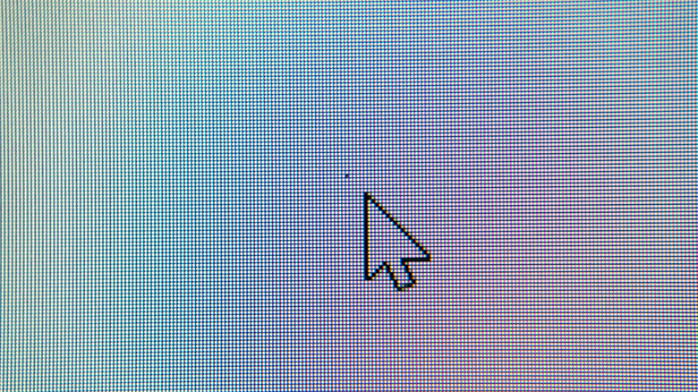 A monitor display with a dead pixel in the center