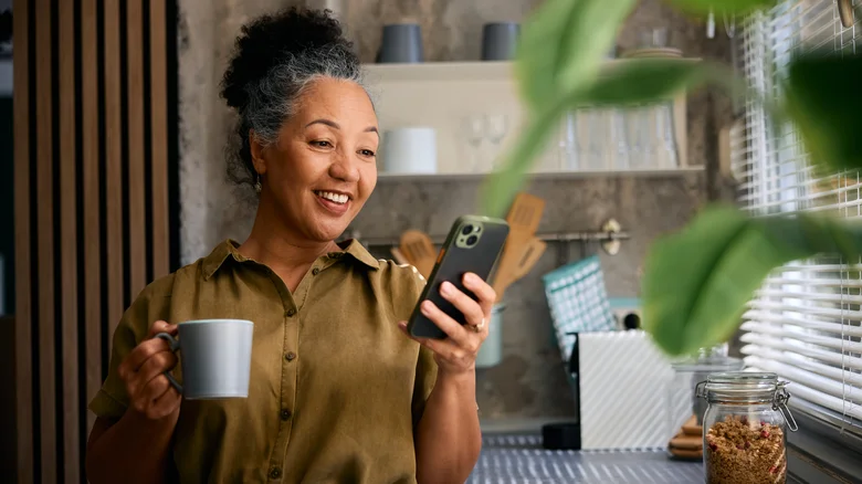 Woman enjoying content on her phone.