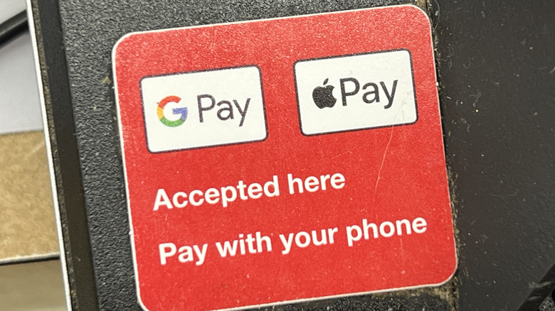 The Google Pay and Apple Pay logos on a sticker that says 
