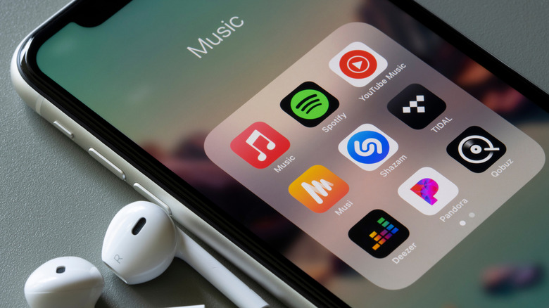 Various music apps in a folder on an iPhone.