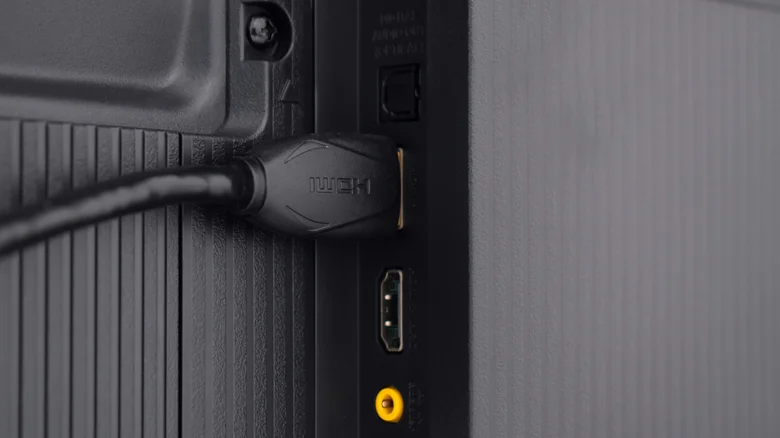 Photo of an HDMI cable plugged into back of a TV.