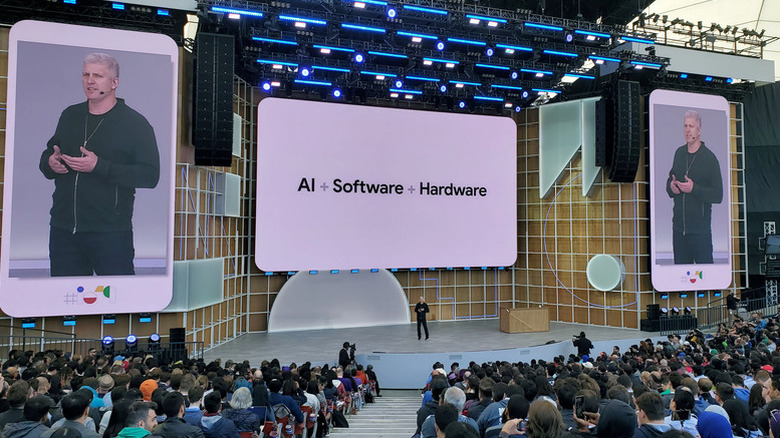 Google's Rick Osterloh onstage at a previous Google I/O with the words 