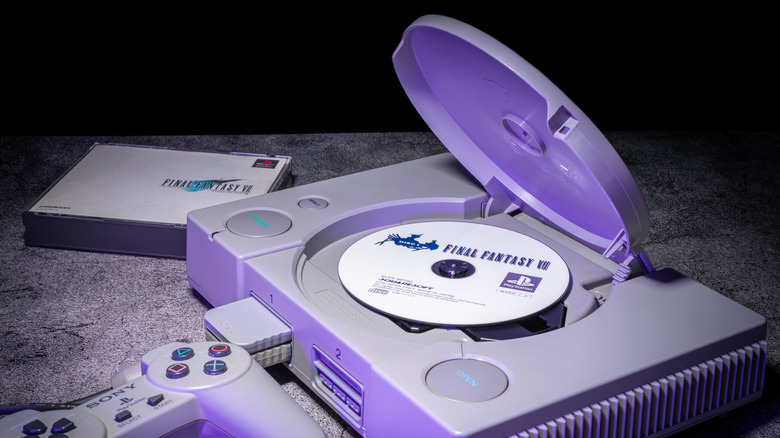 A Sony PlayStation with a copy of Final Fantasy VII nearby and in the disc tray.