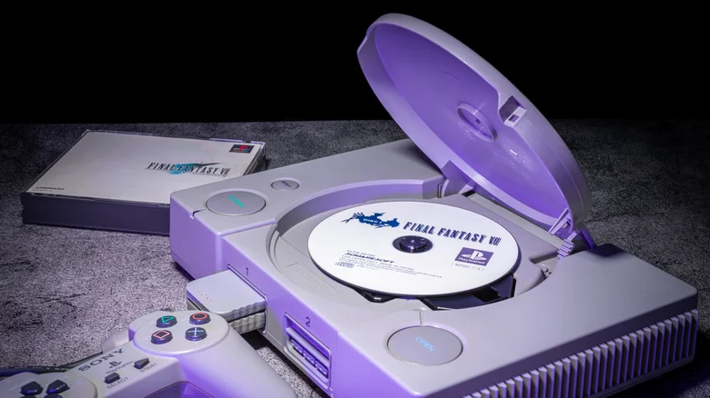 A Sony PlayStation with a copy of Final Fantasy VII nearby and in the disc tray.