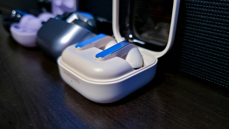 Samsung Galaxy Buds4 Pro sit alongside other Galaxy Buds models on a shelf