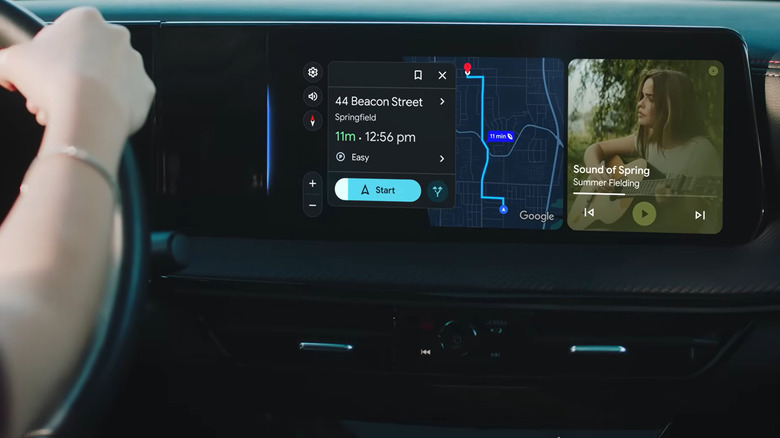 A closeup of an unseen person driving a vehicle shows a dashboard with a Google Map route pulled up and the song Sound of Spring by Summer Fielding playing on the radio.