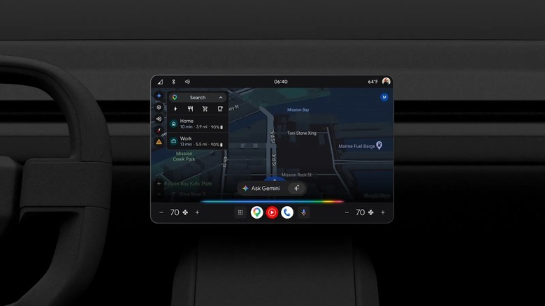 An infotainment dashboard shows a car driving along a road Google Maps, with an Ask Gemini prompt, against a black car interior