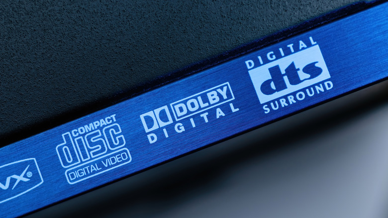 Dolby Digital and DTS Digital Surround logos displayed on the front of a home theater component.