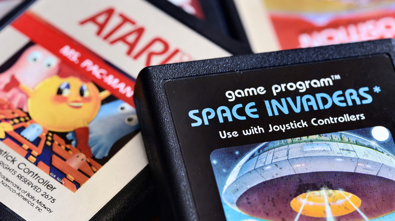 Ms. Pac-Man and Space Invaders Atari 2600 game cartridges.