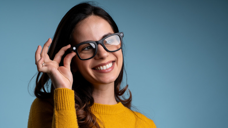Woman using AI smart glasses.