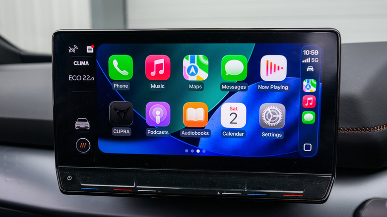 Apple's CarPlay showing its home screen on a car's dashboard.
