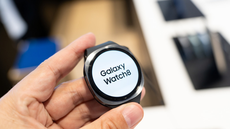 Samsung Galaxy 8 Watch being held in-hand.