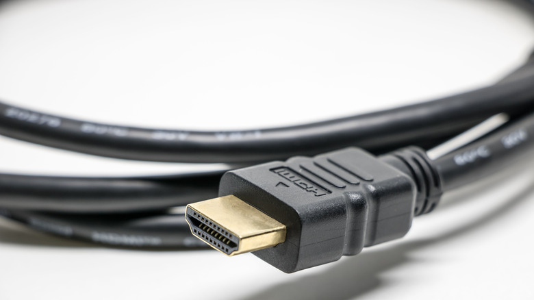 A coiled black HDMI cable.