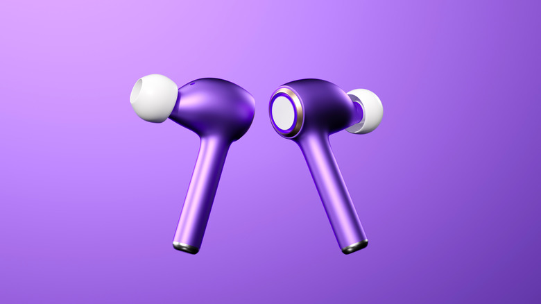 A pair of purple earbuds on a purple background.