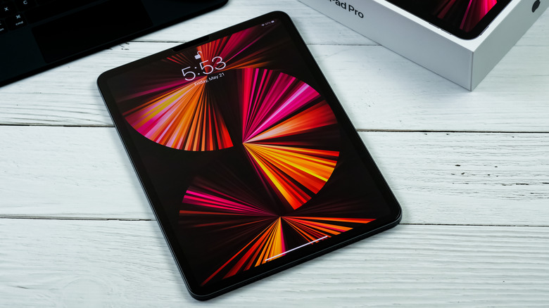 An iPad Pro on a white table.