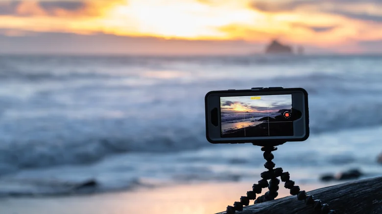 iPhone on a tripod at the beach.