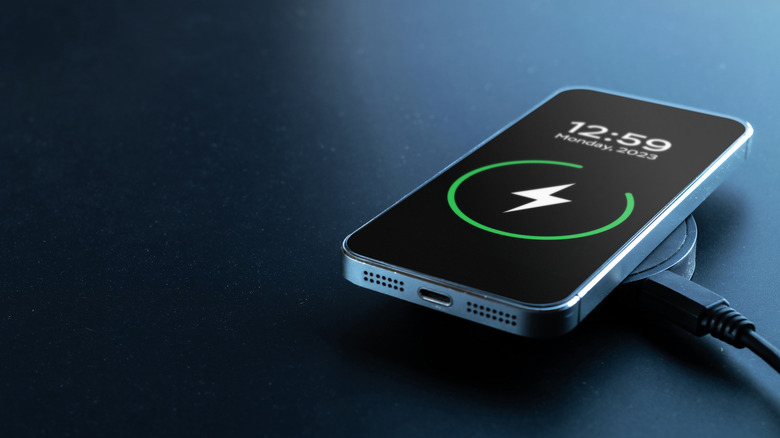 A phone on a wireless charger charging.