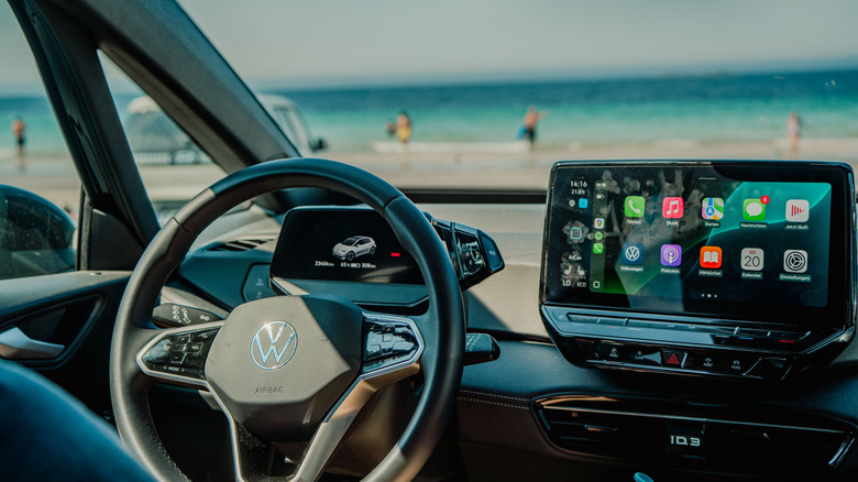 Android Auto on the car's entertainment center with the beach visible through the windshield
