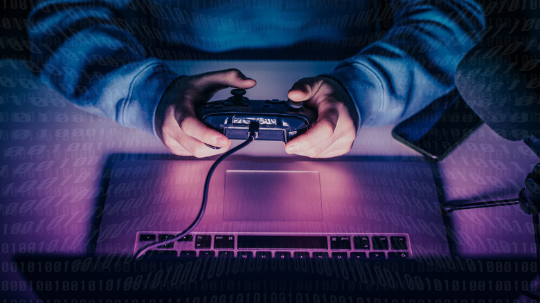 A teen playing on a gaming laptop.