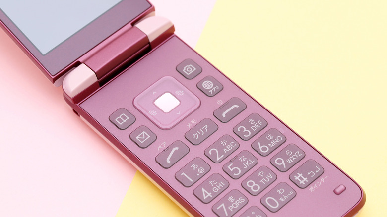 A pink Japanese garakei flip phone.