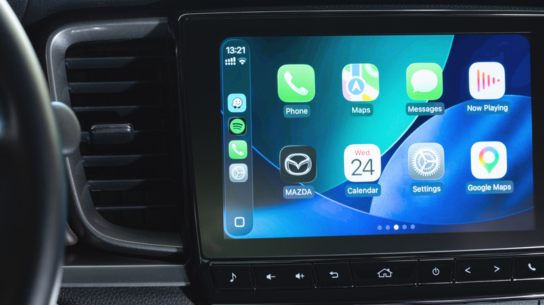 A multi-page CarPlay Home screen on a Mazda dash display.