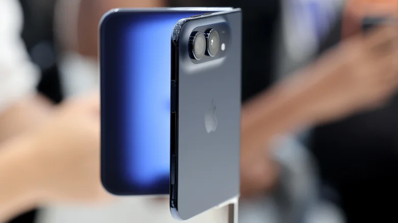 Apple's iPhone Duo, partially folded on a display stand.