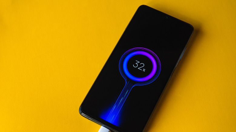 Xiaomi phone plugged in on 32% charge.
