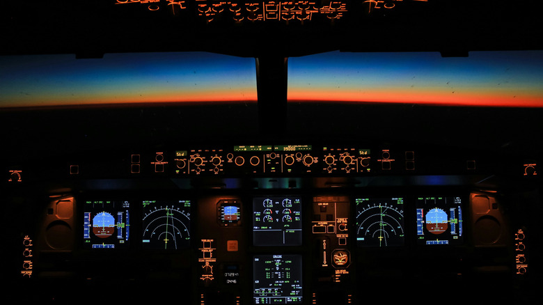 View from inside a plane's cockpit at night.