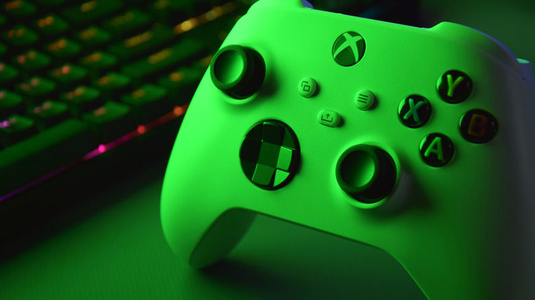 White Xbox controller in green light.