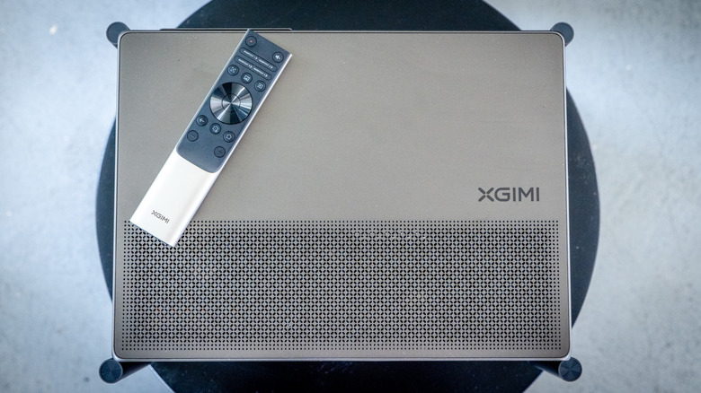 XGIMI Titan Noir Max projector shown from the top with remote control