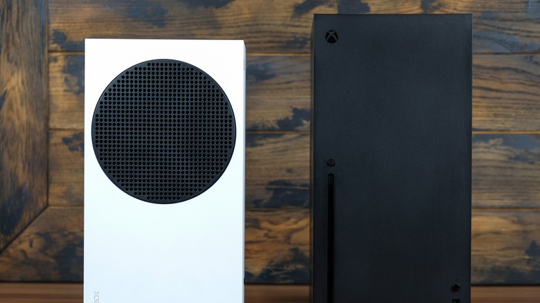A Xbox Series S and Series X standing upright next to each other.