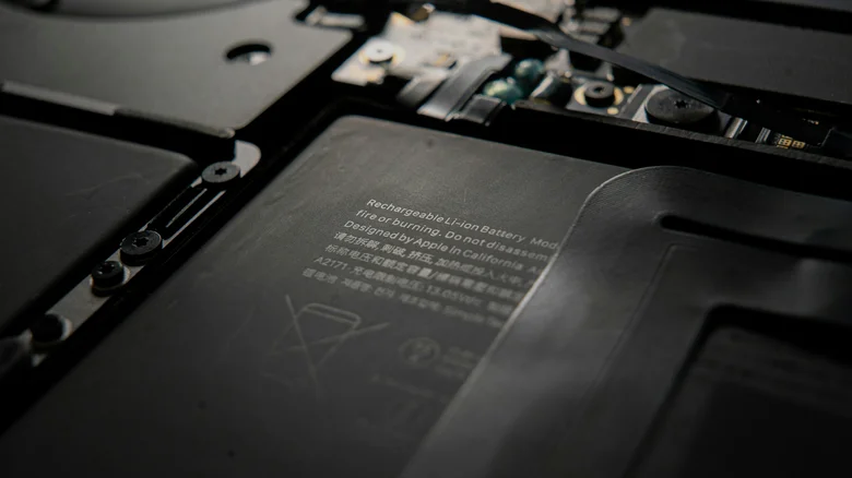 Closeup of an exposed MacBook's battery