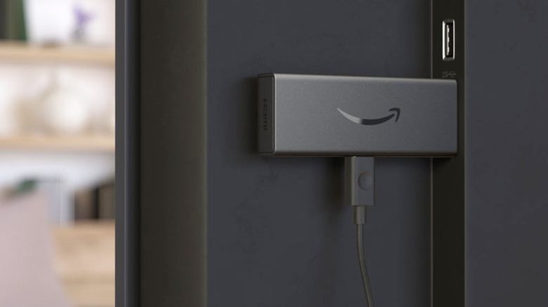 Amazon Fire TV Stick plugged into a TV