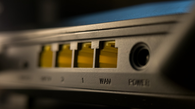 Close-up of a router showing several Ethernet ports, including a WAN port.