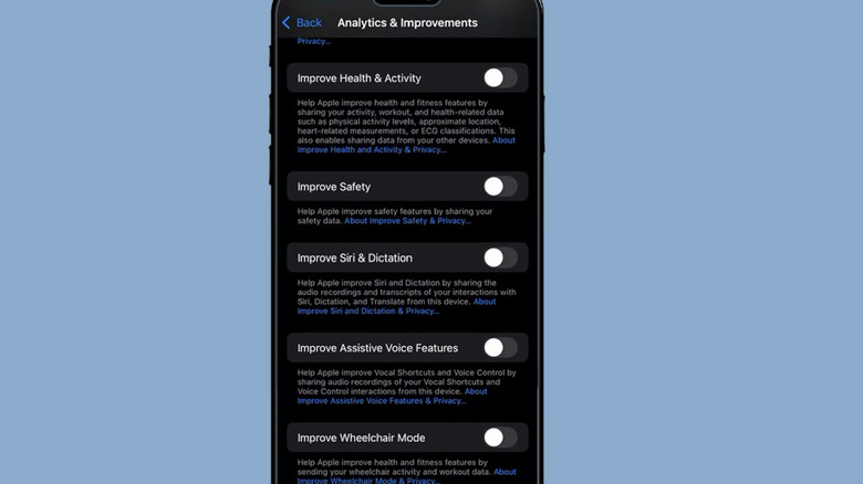 A close-up of an iPhone showing the "Analytics & Improvements" settings, including the "Improve Siri & Dictation" setting.