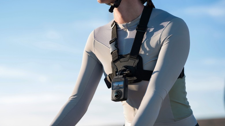 DJI Osmo 360 II shown with chest accessory worn by biker