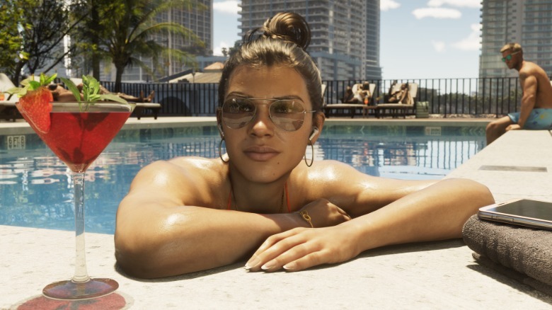 Lucia chills in the pool with a drink in GTA VI.
