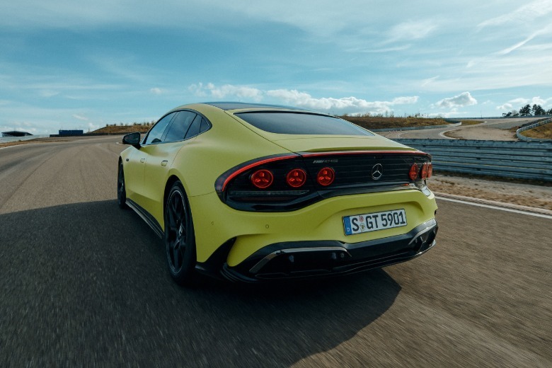 Mercedes-AMG GT 4-Door electric car in yellow is shown from a three-quarter rear angle