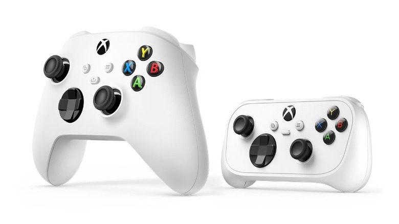 A standard Xbox controller next to a smaller model.