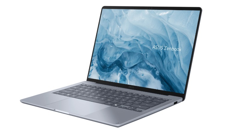 The ASUS Zenbook 14 laptop is shown in a light grey color
