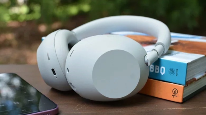 A pair of headphones near books.