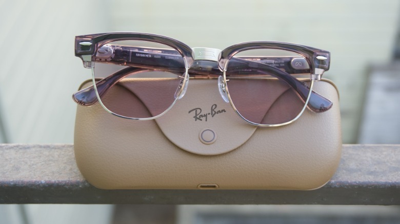 The Ray-Ban Meta Audio glasses on top of the charging case.