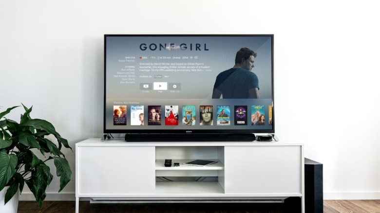 An Apple TV being used and showing menus.