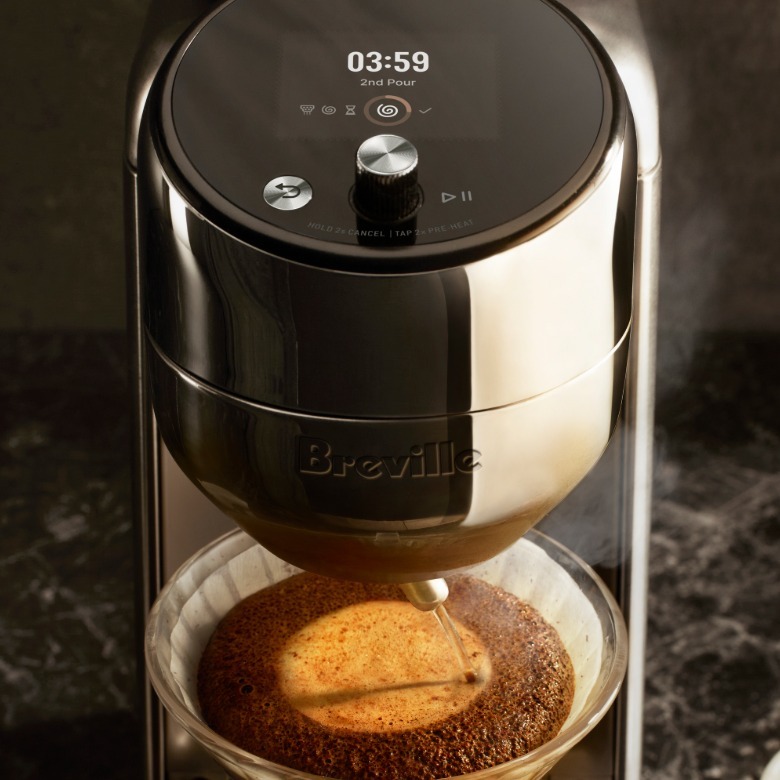 The controls and water spout on the Breville Spiral Luxe.