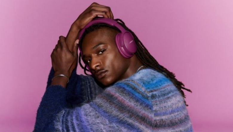 A man wearing purple headphones.