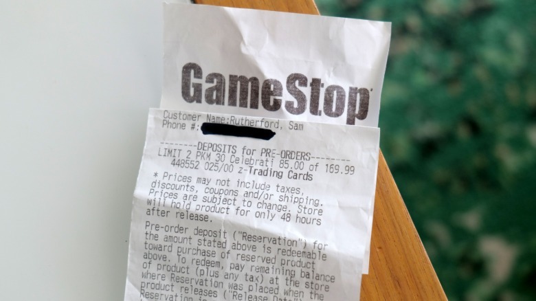 A receipt showing the $170 price of a Pokemon ETB at Gamestop.
