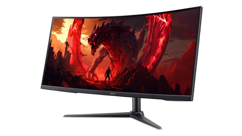 A curved Acer Nitro monitor displaying a red monster.