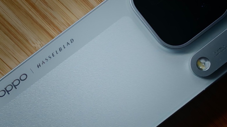 A close-up of Find X10 Pro Max and its textured back.